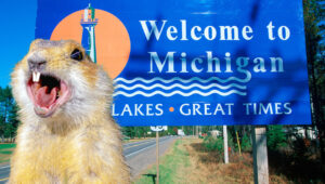 Gopher screaming by Michigan welcome sign